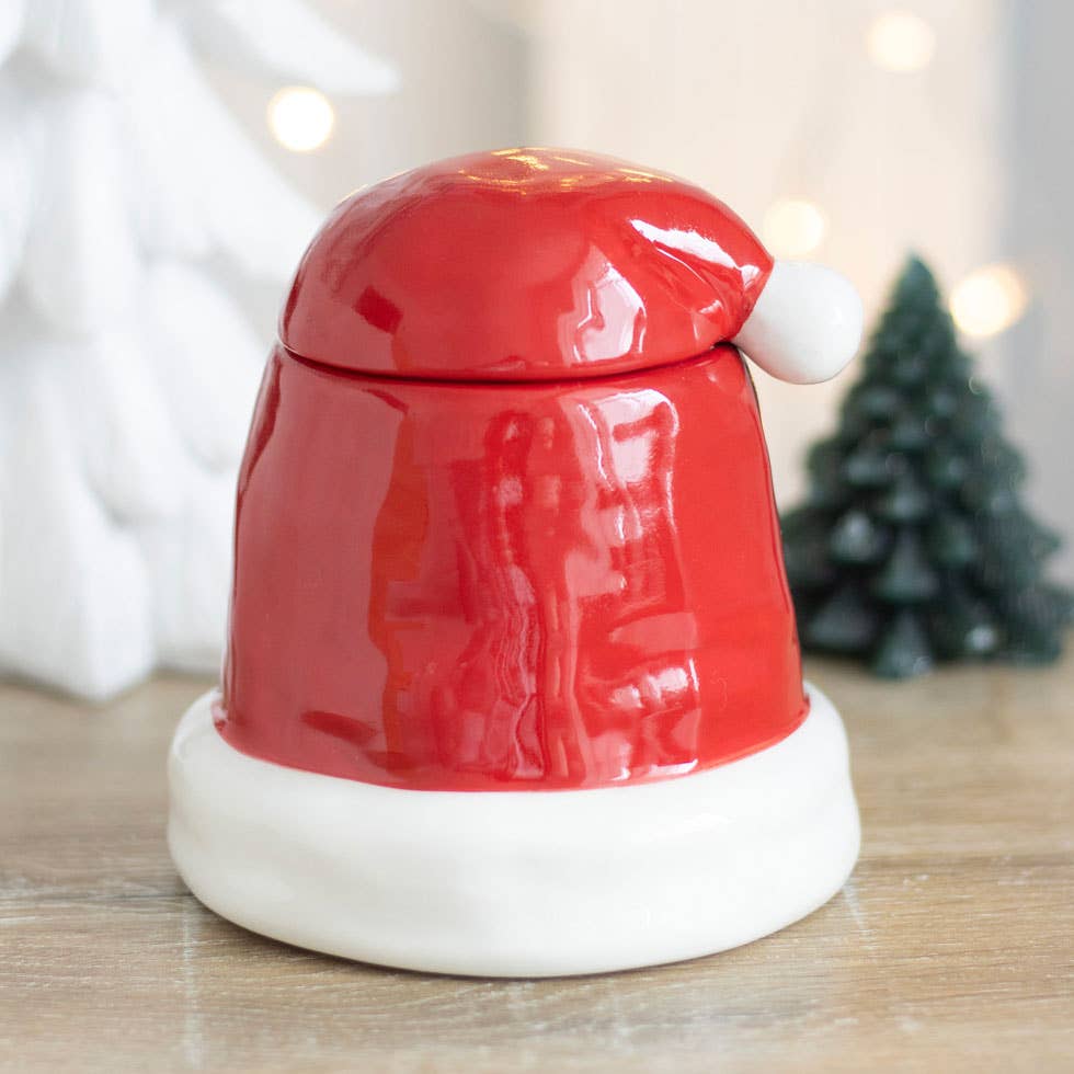 Brûle-parfum avec chapeau de Noël rouge